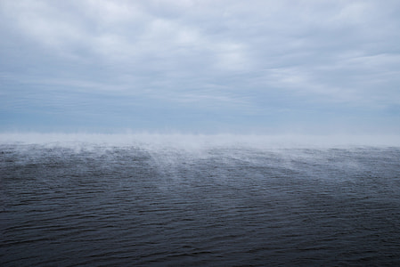 ocean water under white clouds during daytime thumbnail