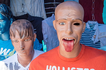 two male mannequins with red and white shirts thumbnail