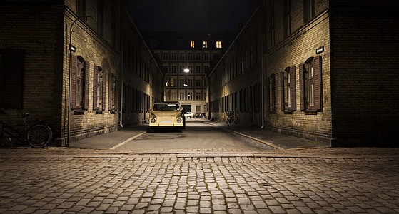 white car parked near the building thumbnail