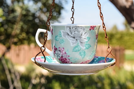 shallow focus photo of hanging teacup and saucer thumbnail