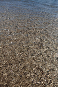 Soft wave of the sea on the sandy beach thumbnail