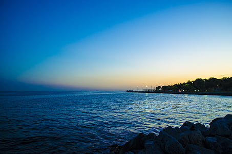 rocky shore during dusk thumbnail