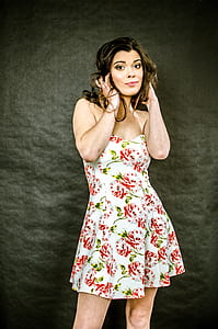 woman wearing white, red, and green floral strapless dress thumbnail