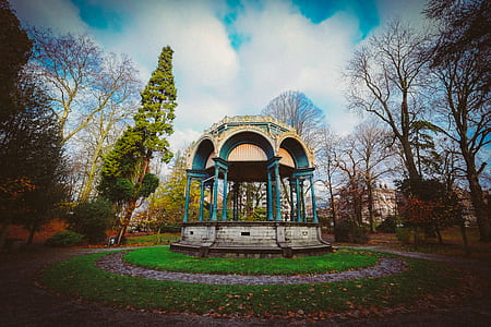 White and Blue Dome Shed in Middle of Trees Photo thumbnail