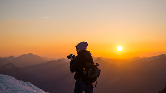 man holding DSLR camera during golden time thumbnail