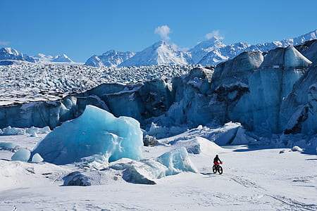 man cycling on snow thumbnail