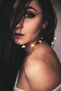 woman with gray one-shoulder top thumbnail