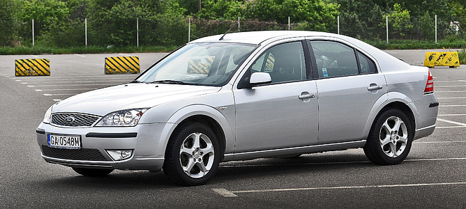 silver Ford sedan on parking area thumbnail