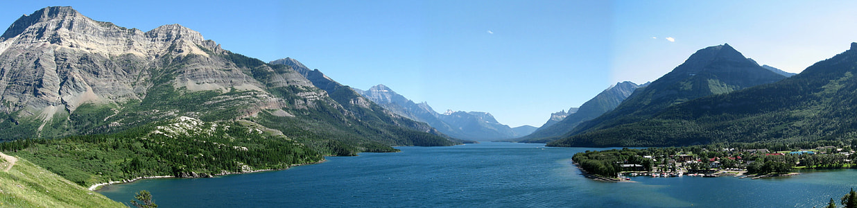 Mountains, shoreline, and lake landscape in Waterton lakes national park panorama thumbnail