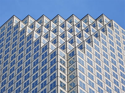 white and blue geometric high-rise building at daytime thumbnail