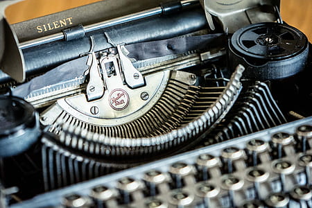 selective focus close up photography of Silent typewriter thumbnail