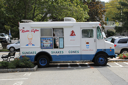 white and blue van on gray road thumbnail