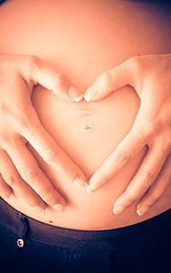 pregnant woman holding her belly thumbnail