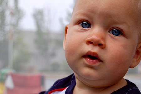 selective focus photography of toddler thumbnail