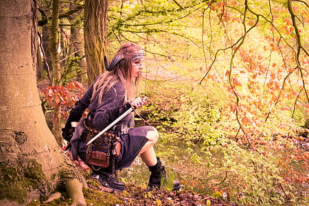 woman in black horns holding sword thumbnail