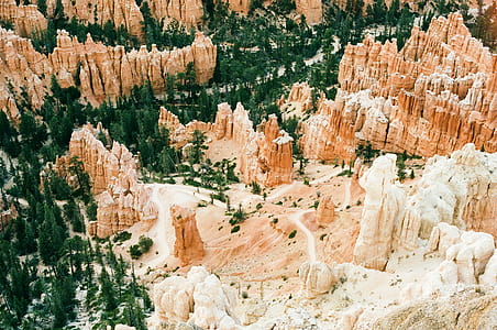 aerial view of mountain surrounded by trees thumbnail