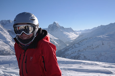 man wearing jacket standing on snowfield wearing helmet and goggles thumbnail