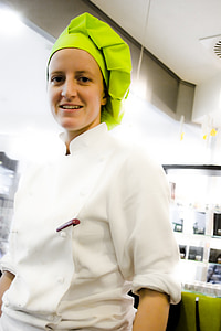 woman in chef dress near table thumbnail