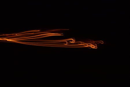 time-lapse photography of orange light with black background thumbnail