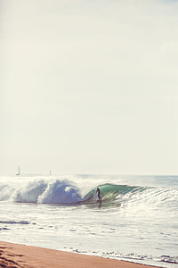 person playing surf during daytime thumbnail