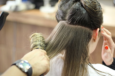 person holding black hair brush thumbnail