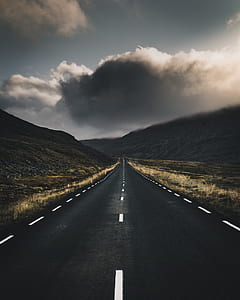 black pathway during cloudy day thumbnail