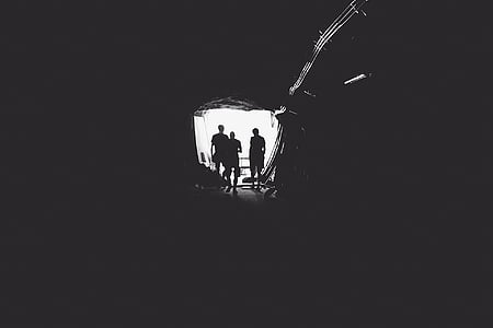 three person under round tunnel thumbnail