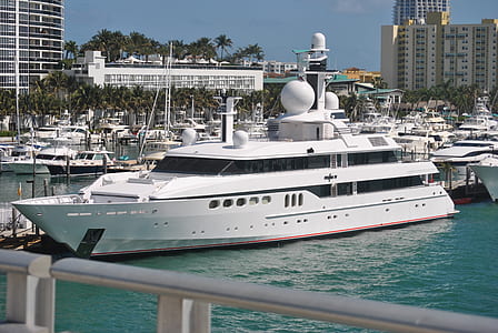 white yacht on body of water thumbnail