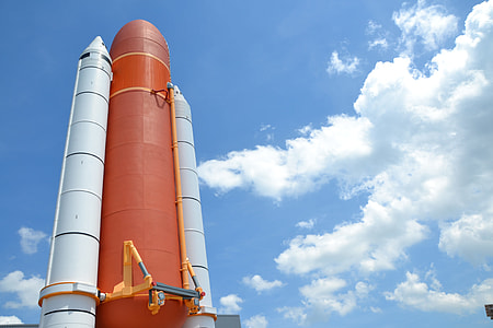 red and gray space shuttle during daytime thumbnail