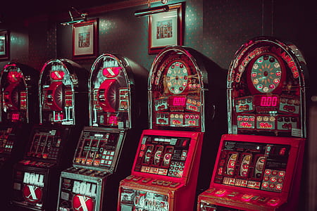 red and white slot machines behind brown wall thumbnail