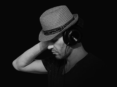 grayscale photo of man wearing headset thumbnail