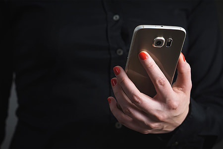 Person using mobile smartphone in hand thumbnail