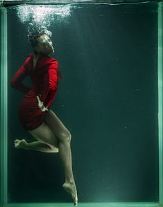 Photo of Woman Wearing Red Dress Underwater thumbnail