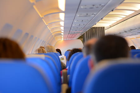 people sitting in airplane seats thumbnail