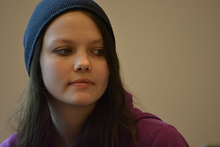 woman wearing navy-blue knitted cap thumbnail