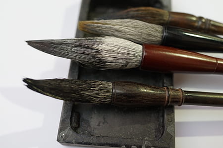 closeup photography of four beige and brown wooden paint brushes thumbnail