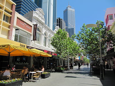 people sitting under yellow canopy tent thumbnail
