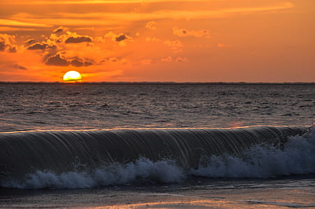 water waves during sunset thumbnail