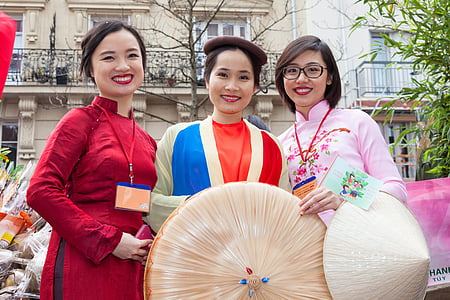 three women's holding their hats thumbnail