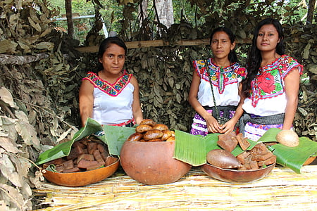 women standing in front of table thumbnail
