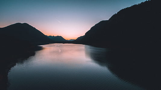river between silhouette of trees thumbnail