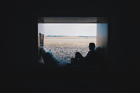 man sitting on window thumbnail