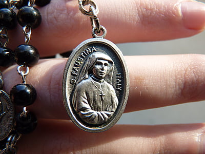 person holding rosary thumbnail