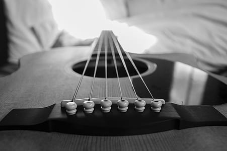 Wooden Acoustic Guitar Macro Photography in Grayscale Photo thumbnail