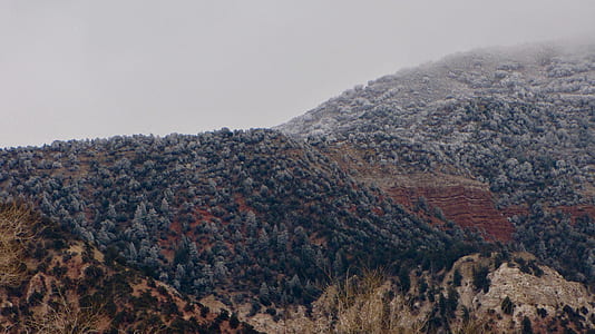 aerial photography of gray mountain under white sky thumbnail