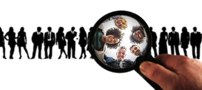 person holding black magnifying glass thumbnail