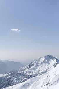 snow-covered mountain under blue sky thumbnail