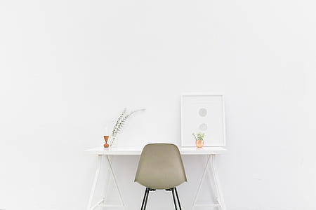gray chair in front of white table thumbnail