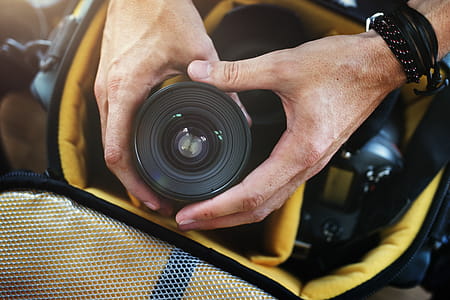 Person Holding Black Camera Lens thumbnail
