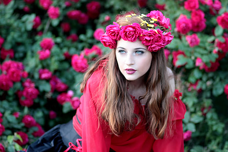 selective focus photography of woman behind pink Bougainvillea thumbnail